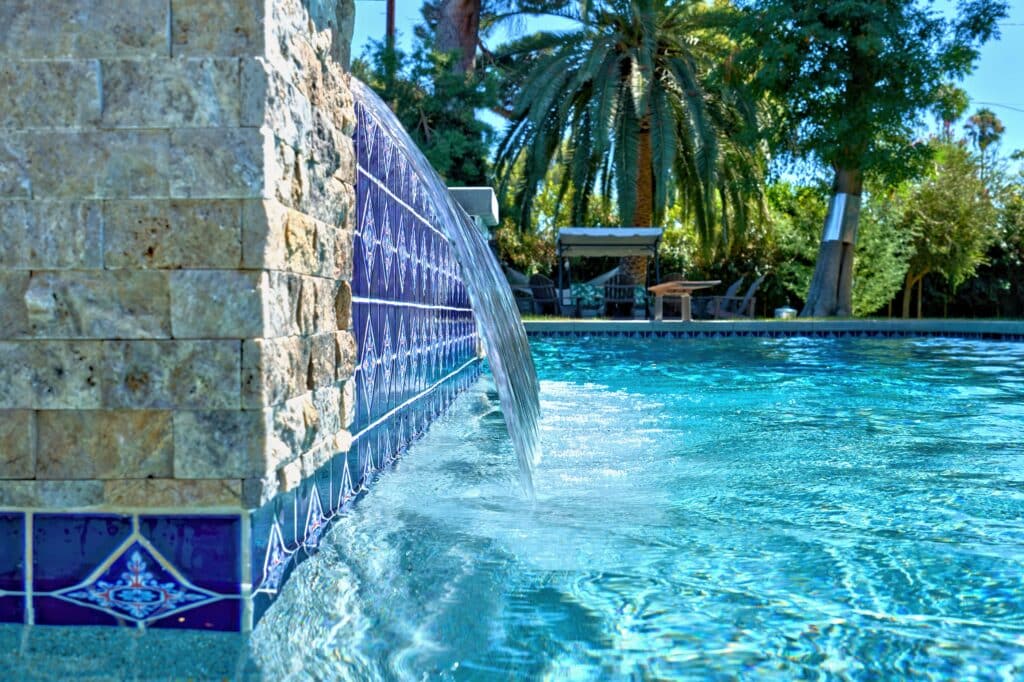 Pool with fountain and trees