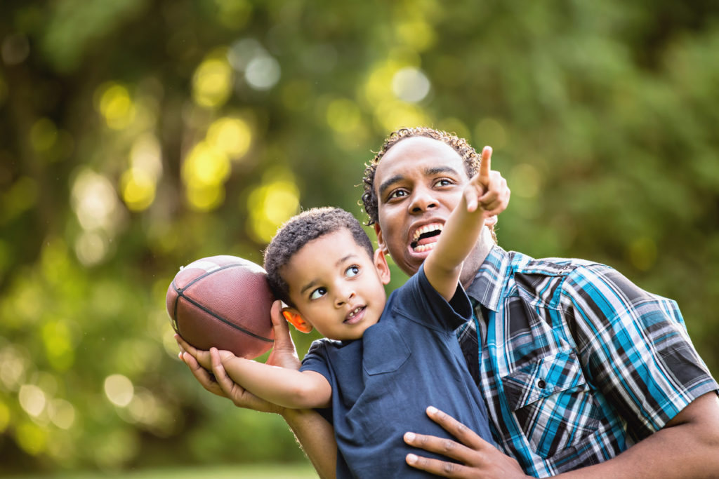 father and son playing