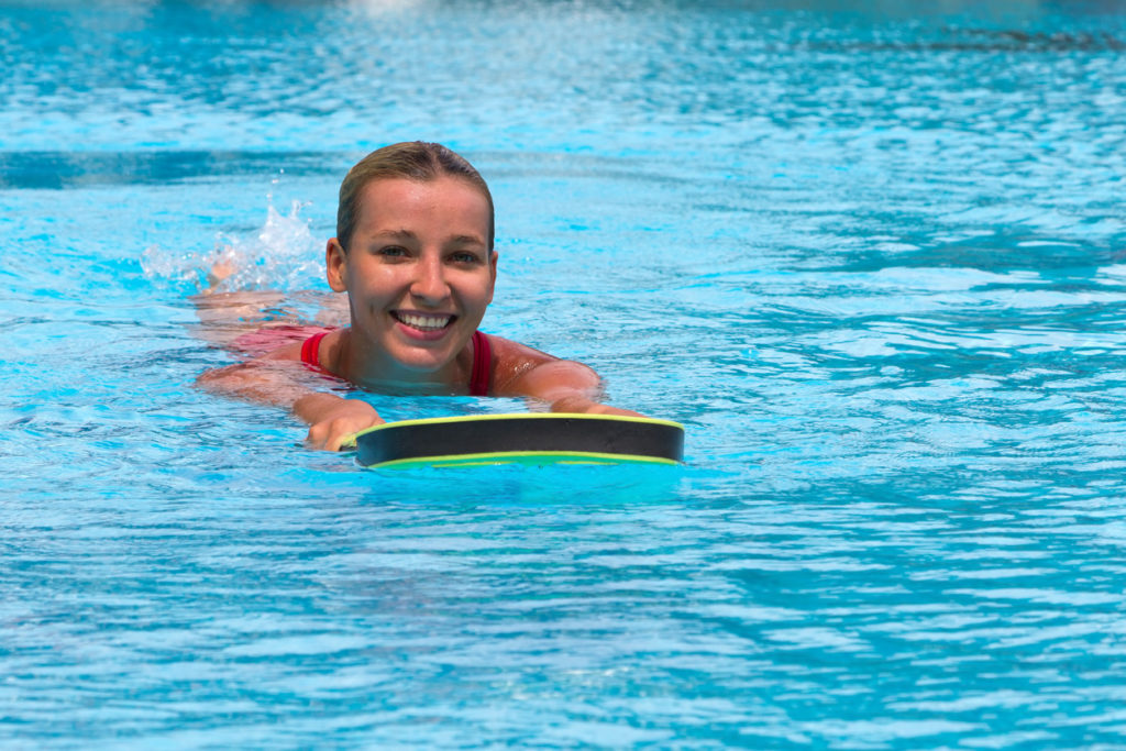 Kick boarding in the pool