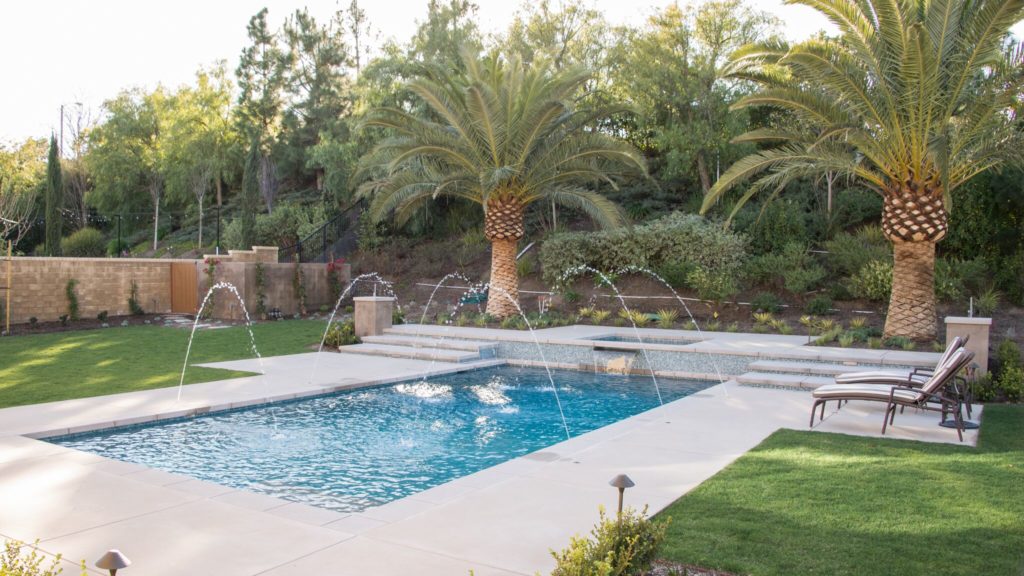 Pool with tropical lanscape and some fountains