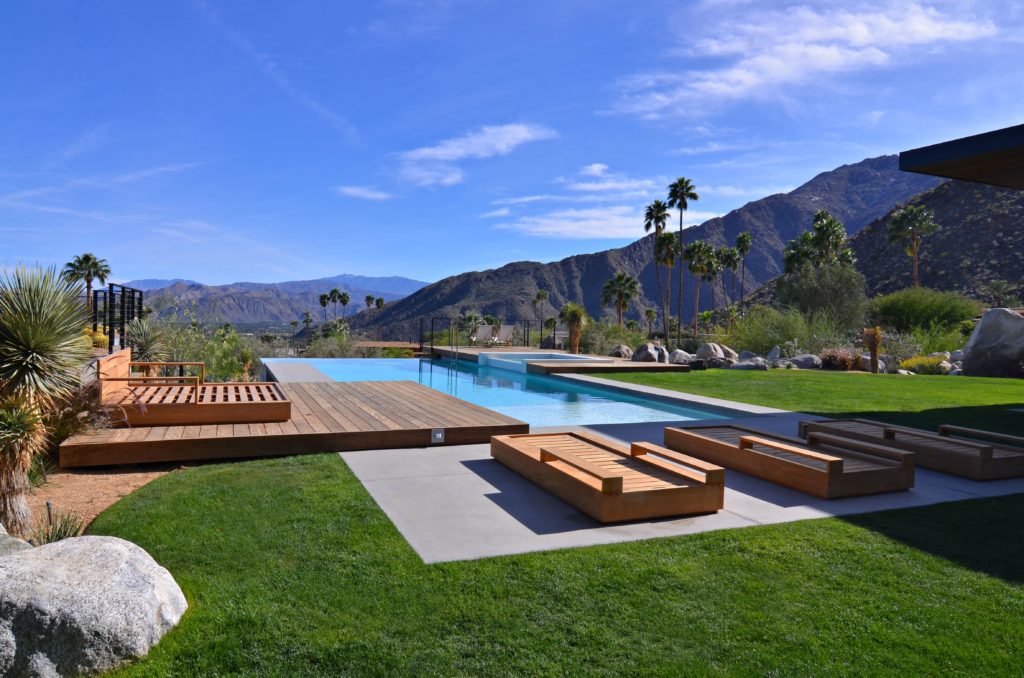 A swimming pool with a breath taking mountain view