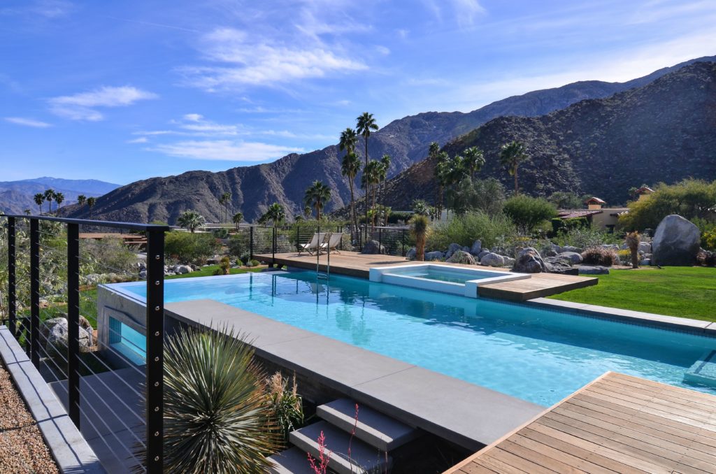 A swimming pool with a breath taking mountain view