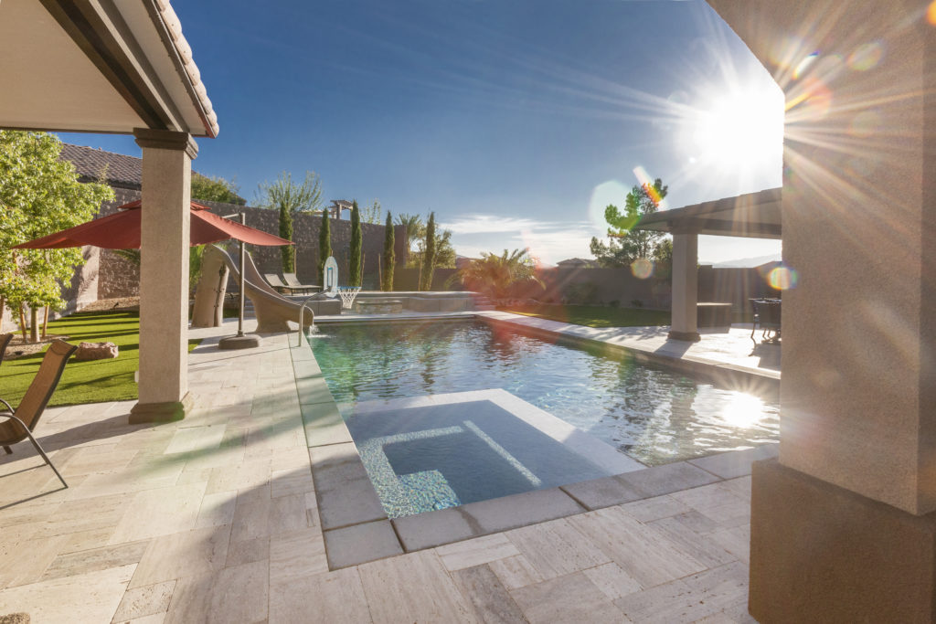 pool with slide and basketball ring