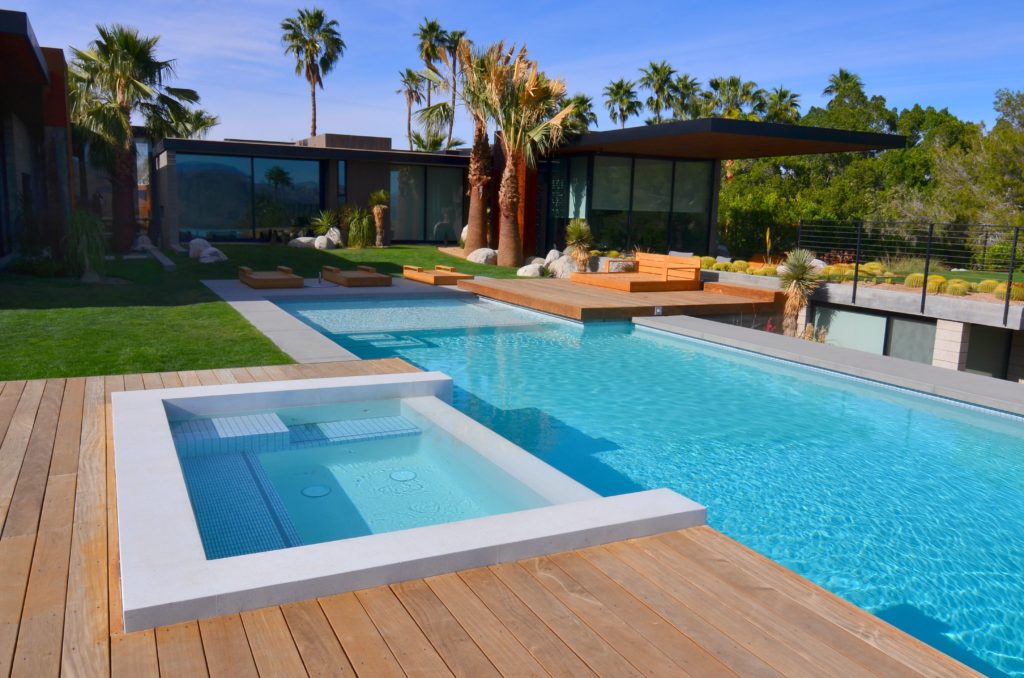 A tropical landscape and a pool