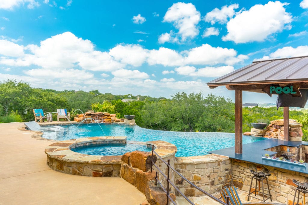 Swimming pool with some fountain , jacuzzi,and mini bar